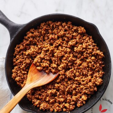 Close-up of perfectly browned ground beef in a pan showing uniform color and texture