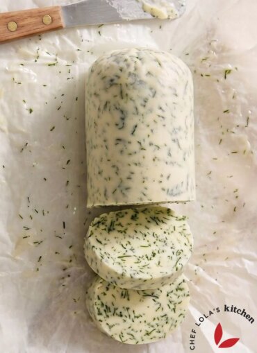 Homemade sliced garlic butter with herbs