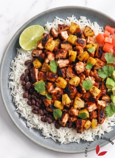 Homemade chicken al pastor served neatly with rice and caramelized pineapple.